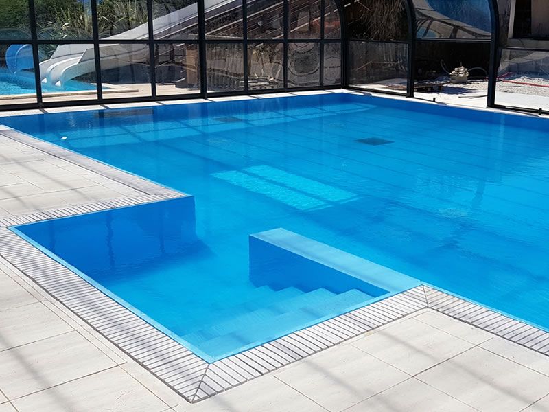 Finished pool illustrating a precast structure with a reinforced PVC interior
