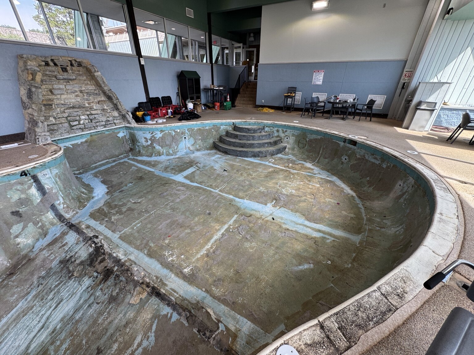 Existing deck cut back around the Hueston Woods Lodge pool coping