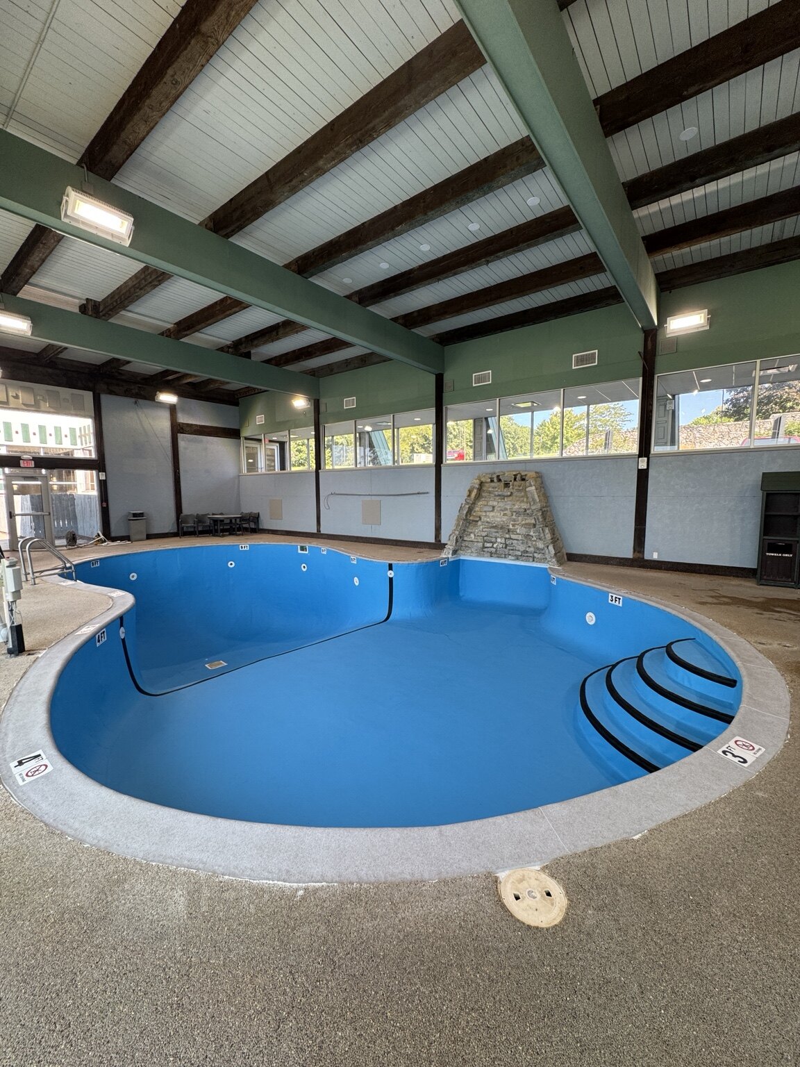 Adriatic Blue membrane and Light Grey coping wrap installation at Hueston Woods Lodge
