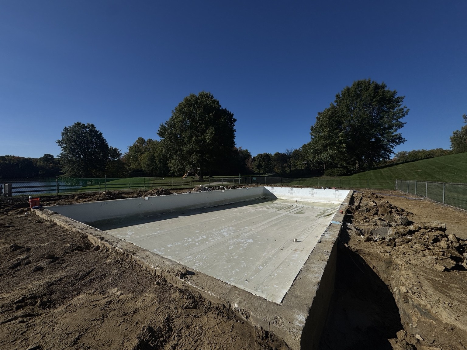 Drained Lake in the Woods pool with the previous membrane still in place