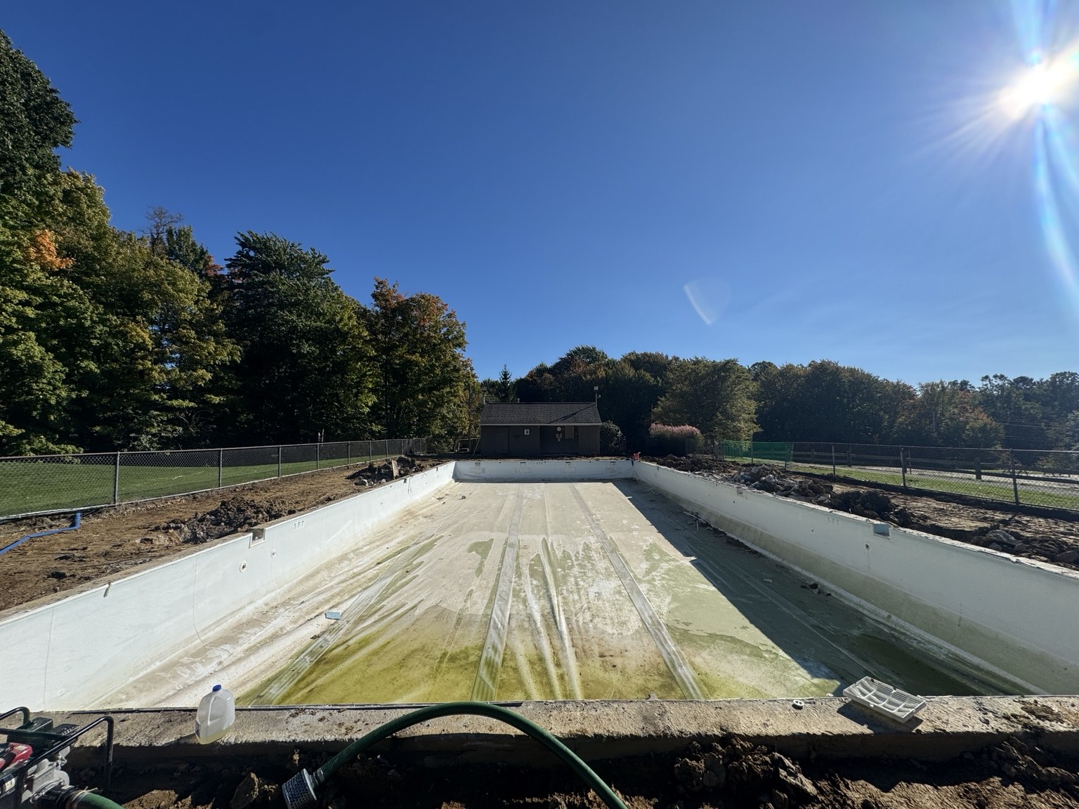 Old membrane on the floor and walls of the drained Lake in the Woods pool