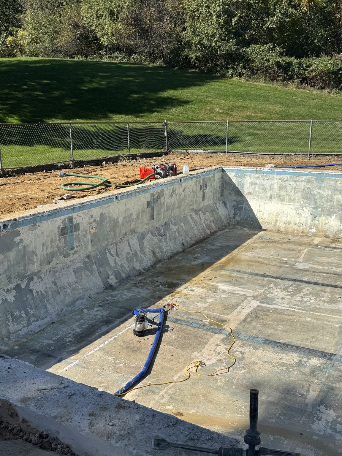Exposed pool walls and floor at Lake in the Woods awaiting repairs