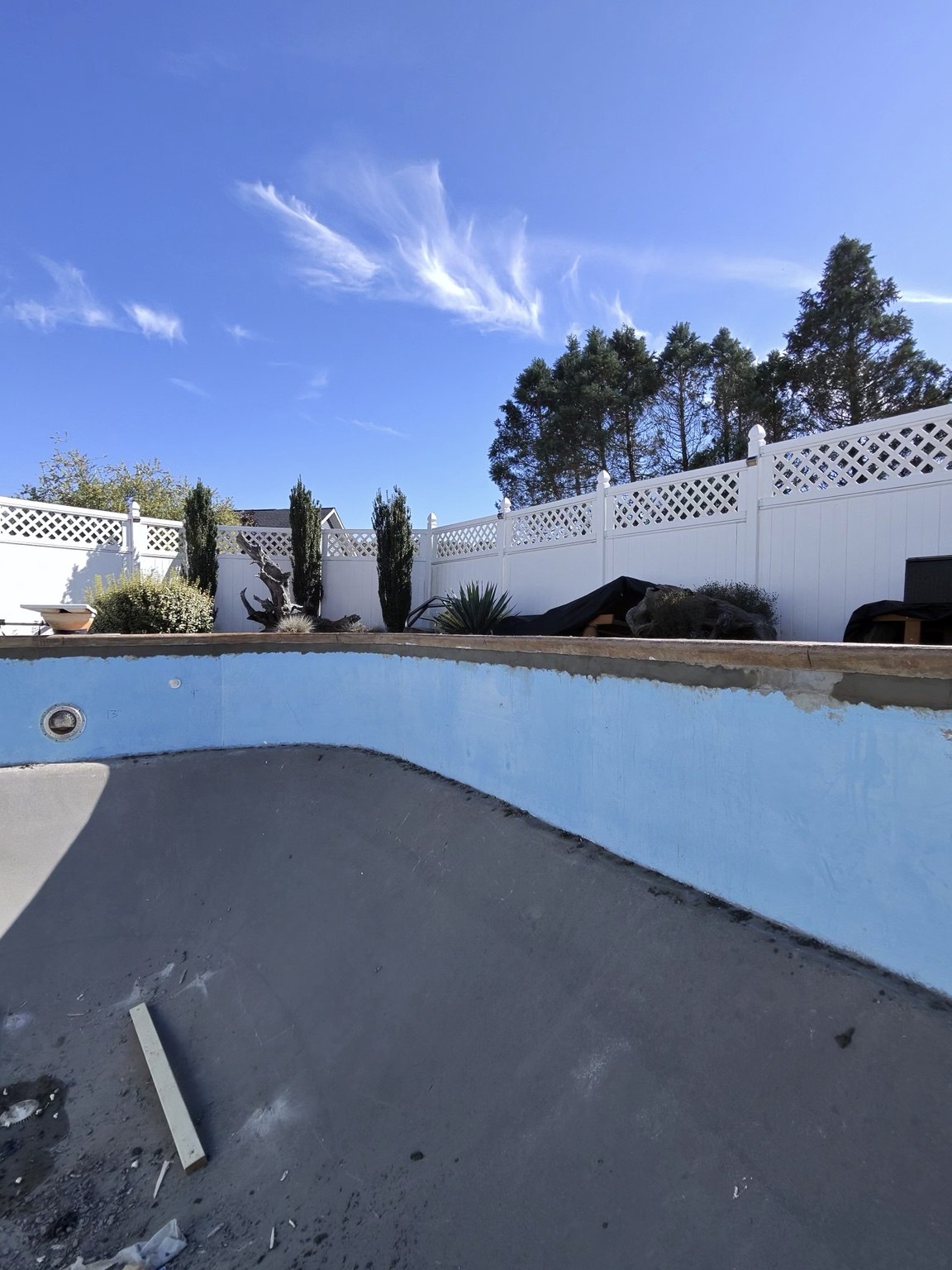 Backfilled and skim-coated upper wall perimeter of the Millersburg residential pool