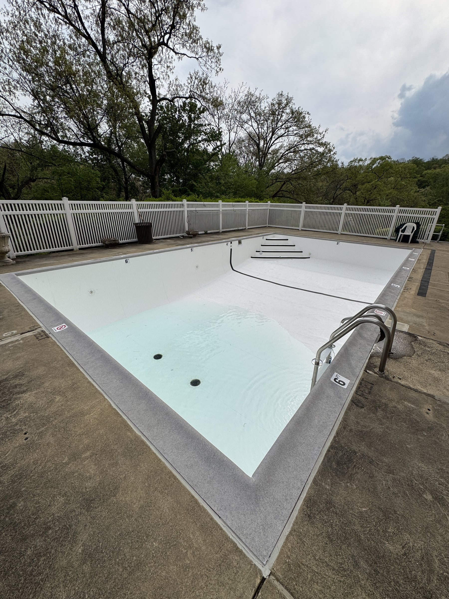 Finished white PVC membrane pool with coping wrap in Pennsylvania